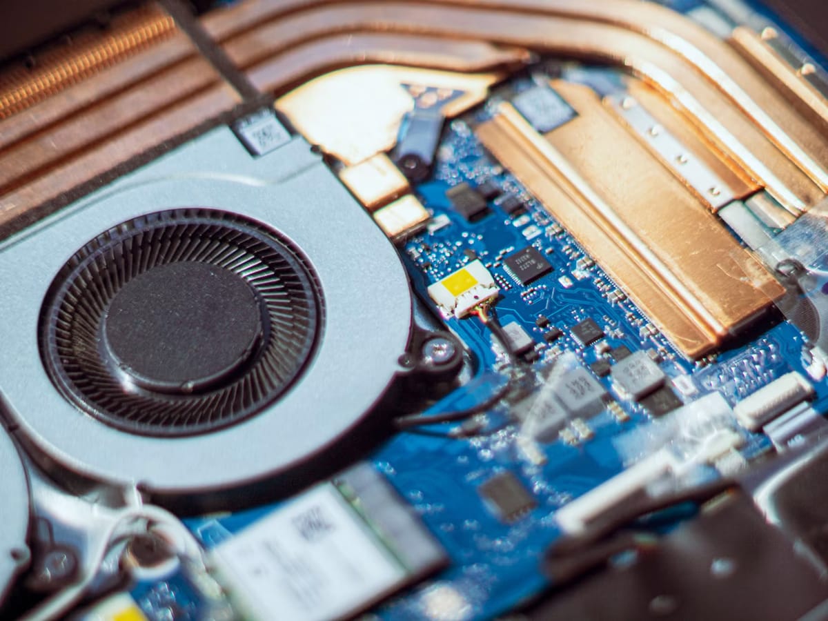 Close-up of electronic circuitry and a cooling fan